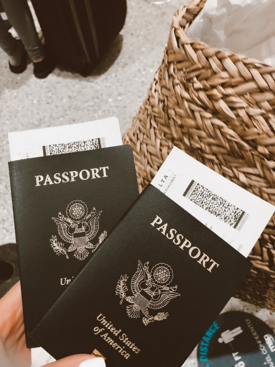 a person holding two passports