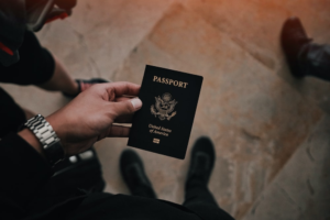 a person holding a passport in their hand