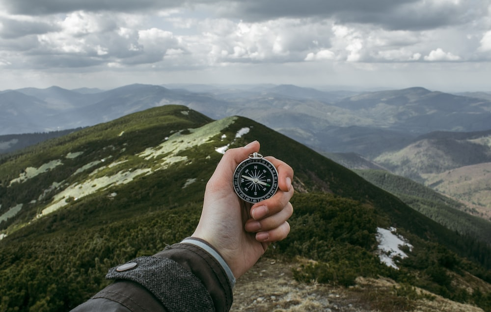 a person holding a compass