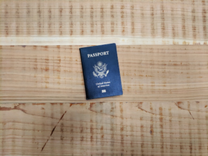 an American passport on a wooden surface