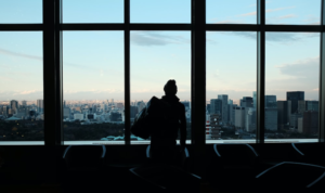 a person looking out a window 