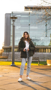 a student holding headphones