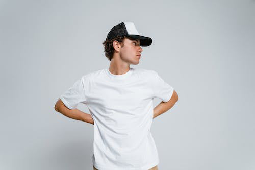 man wearing a cap looking sideways