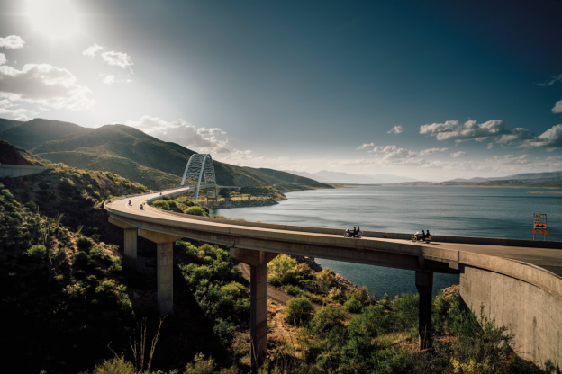 A photo showing a bridge by a lake.