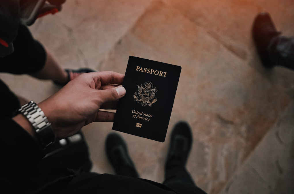 A person carrying a passport.