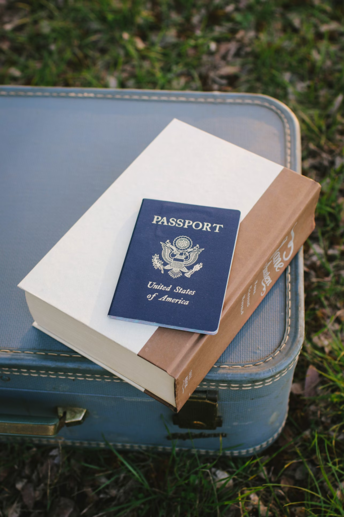 A close-up of a US passport on a thick book