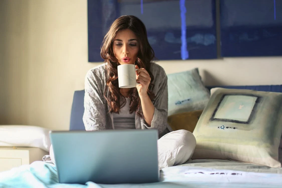 A person looking at an expedited passport service website on a laptop.