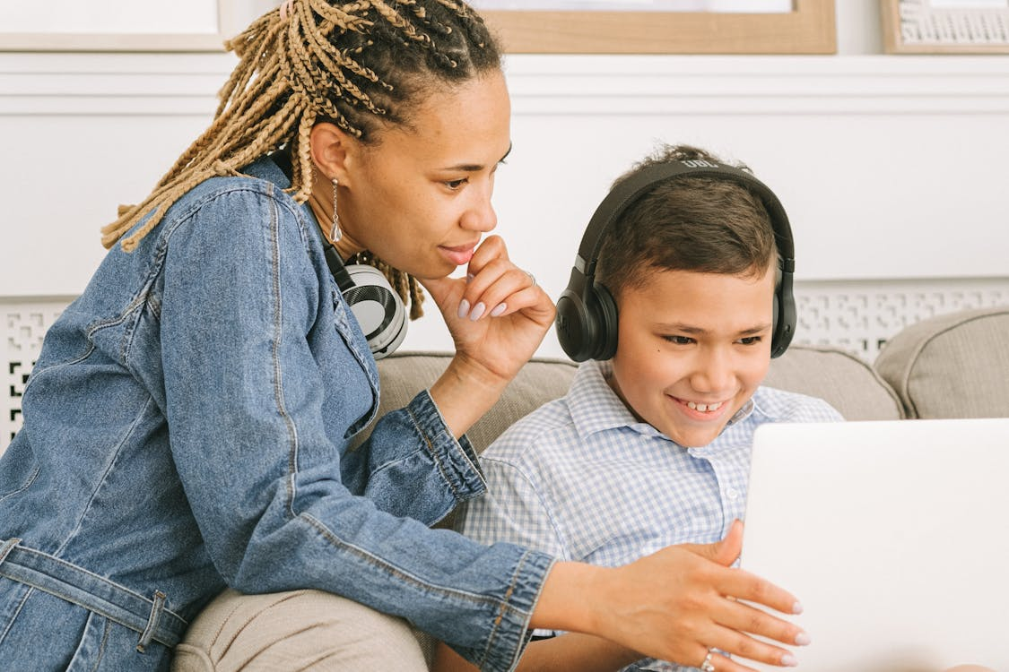 A parent helping a child fill out a passport application.