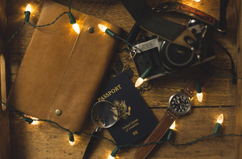 A US passport with string lights.