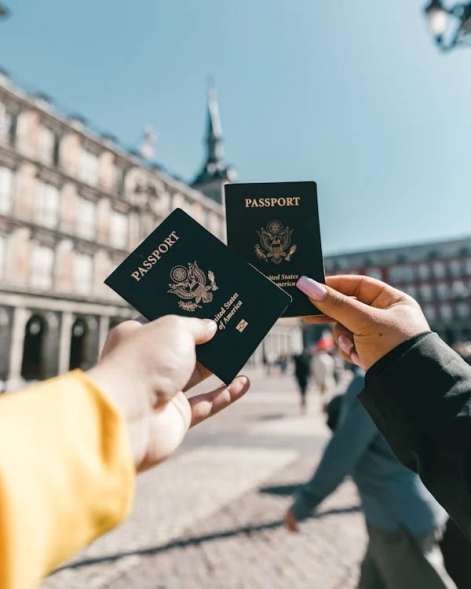 A person holding a freshly renewed passport.