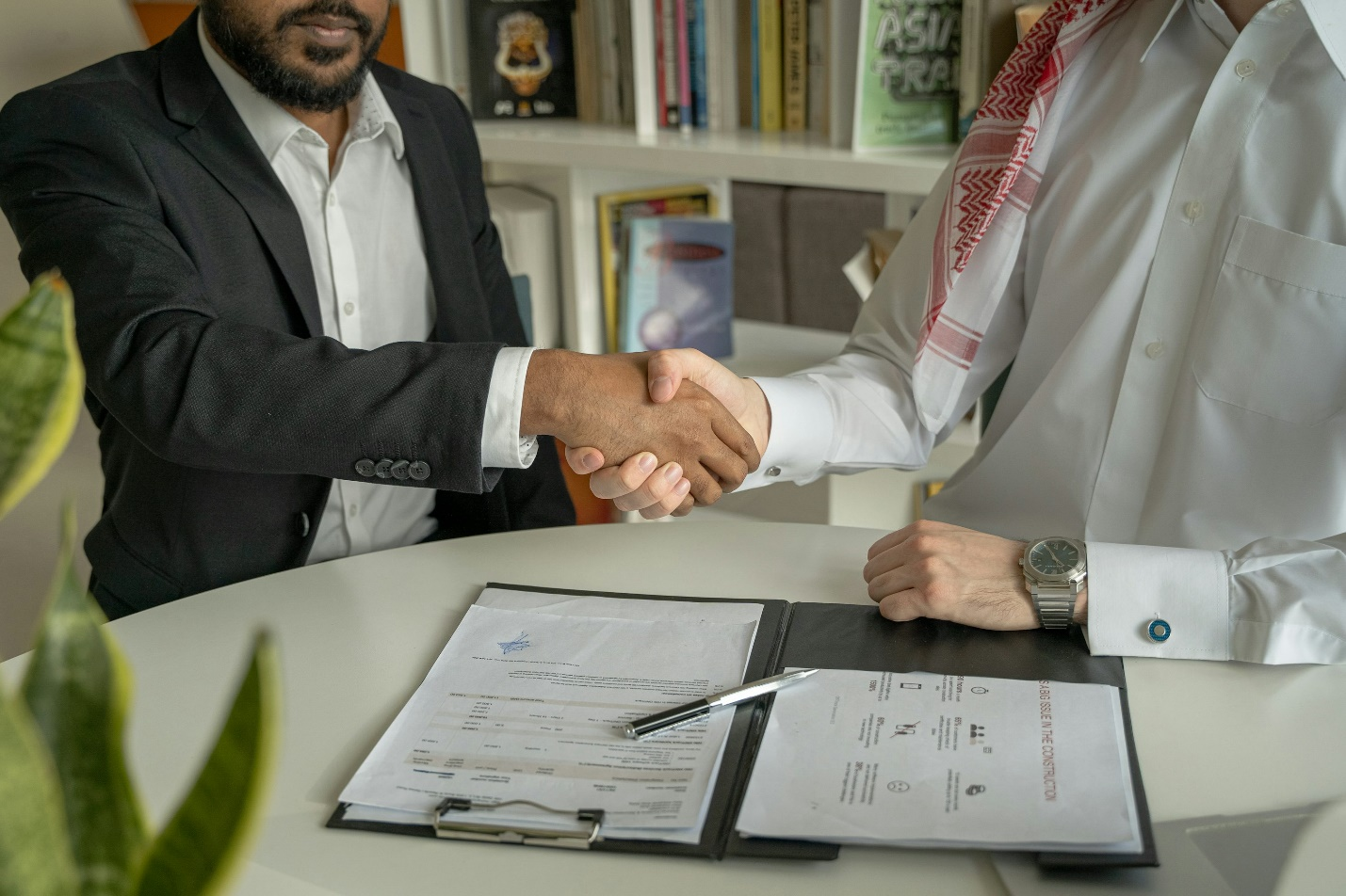 Two people shaking hands. 