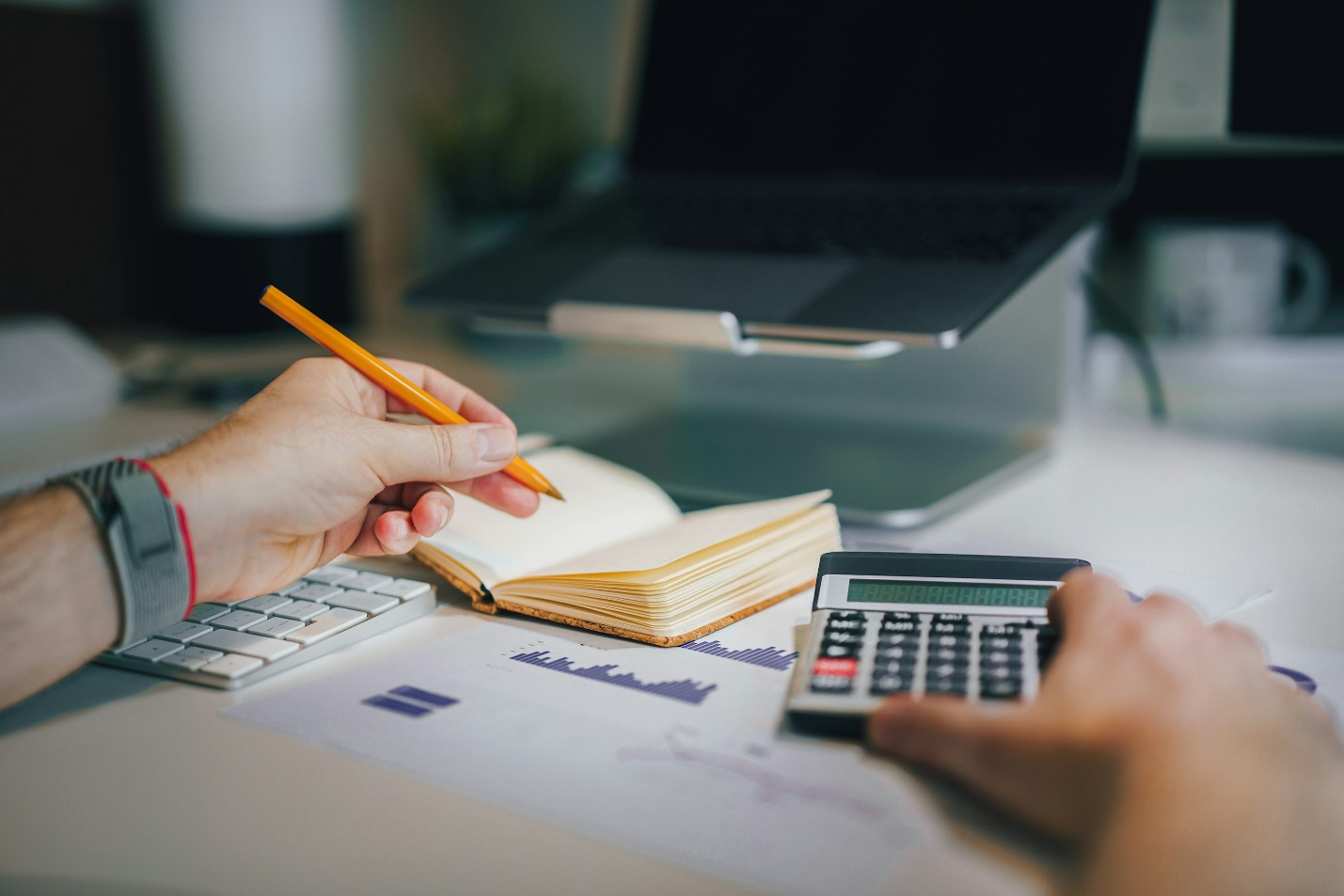 A person writing something on documents.