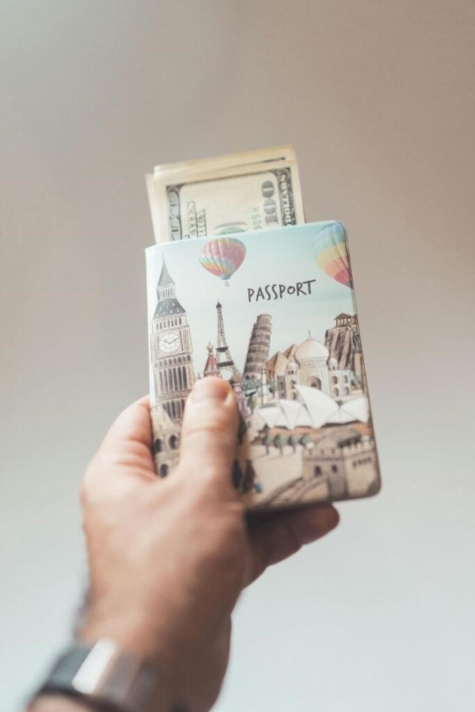 A picture of a person holding a passport wallet