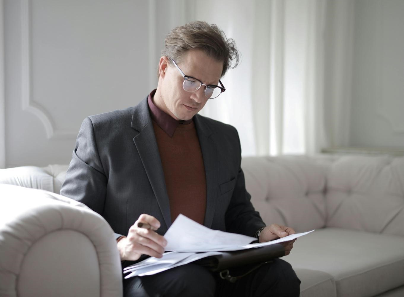 A picture of a person reading documents