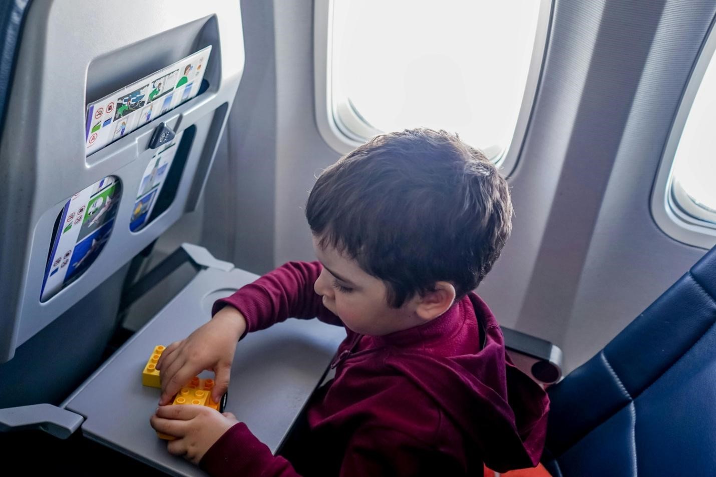 A picture of a child playing in an airplane