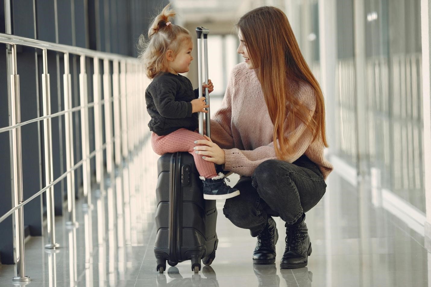 A picture of a woman and a child at airport 