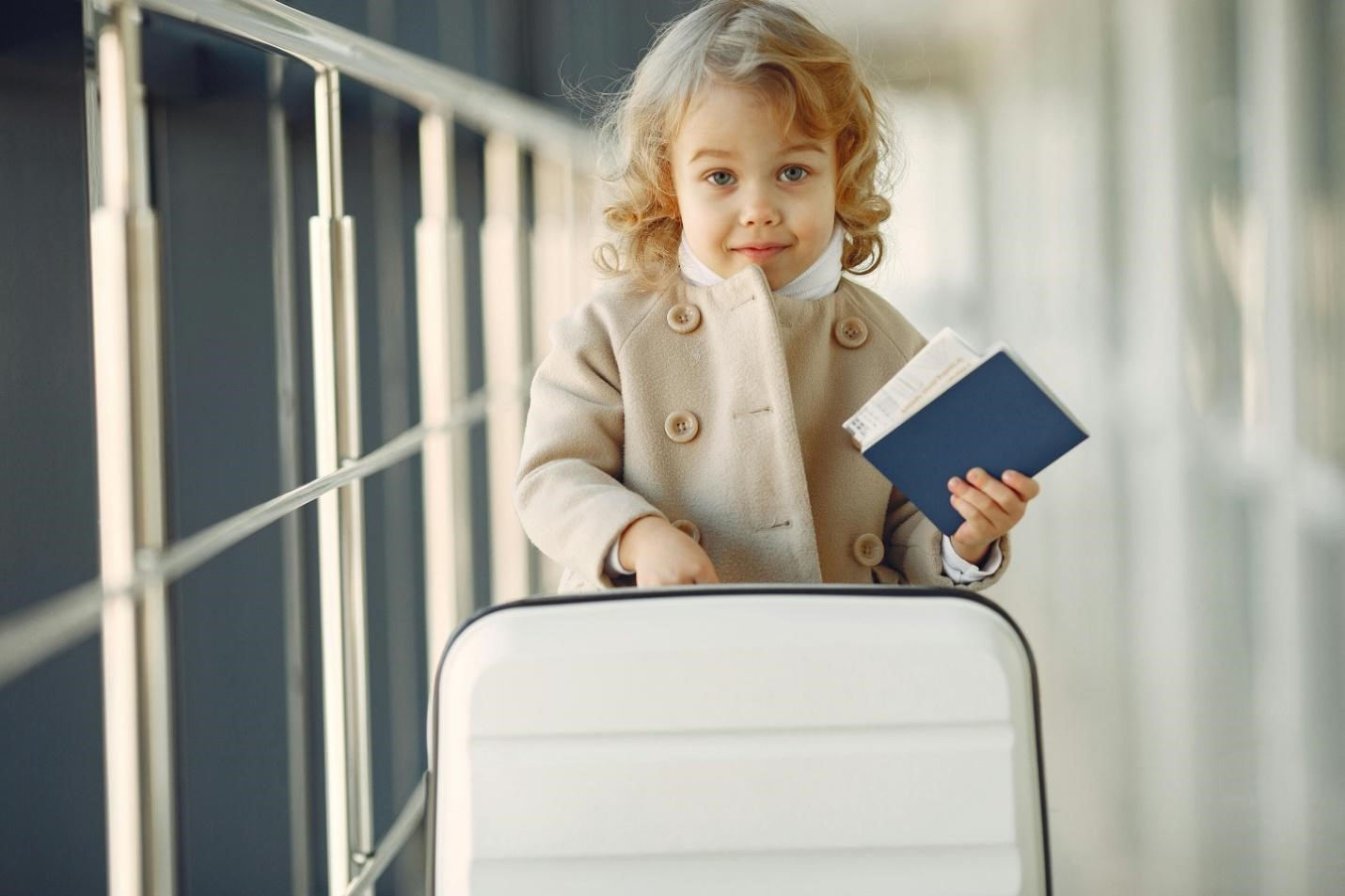 A picture of a child holding a passport