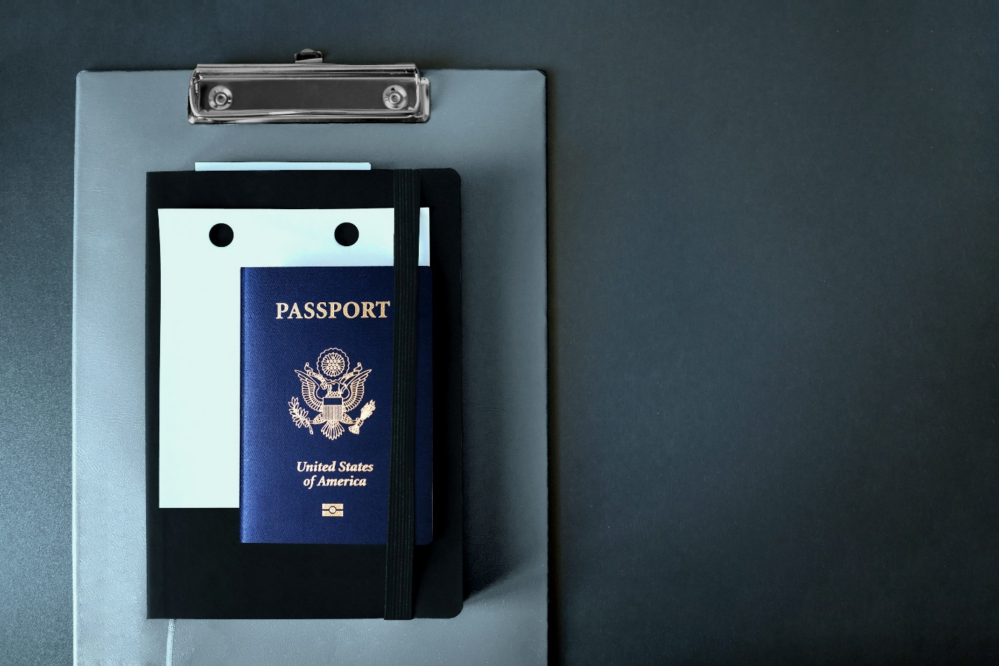 an American passport place don’t a clipboard