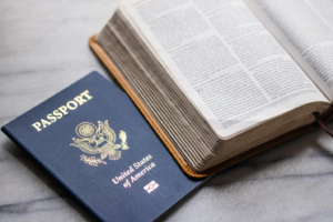 an American passport placed underneath a book